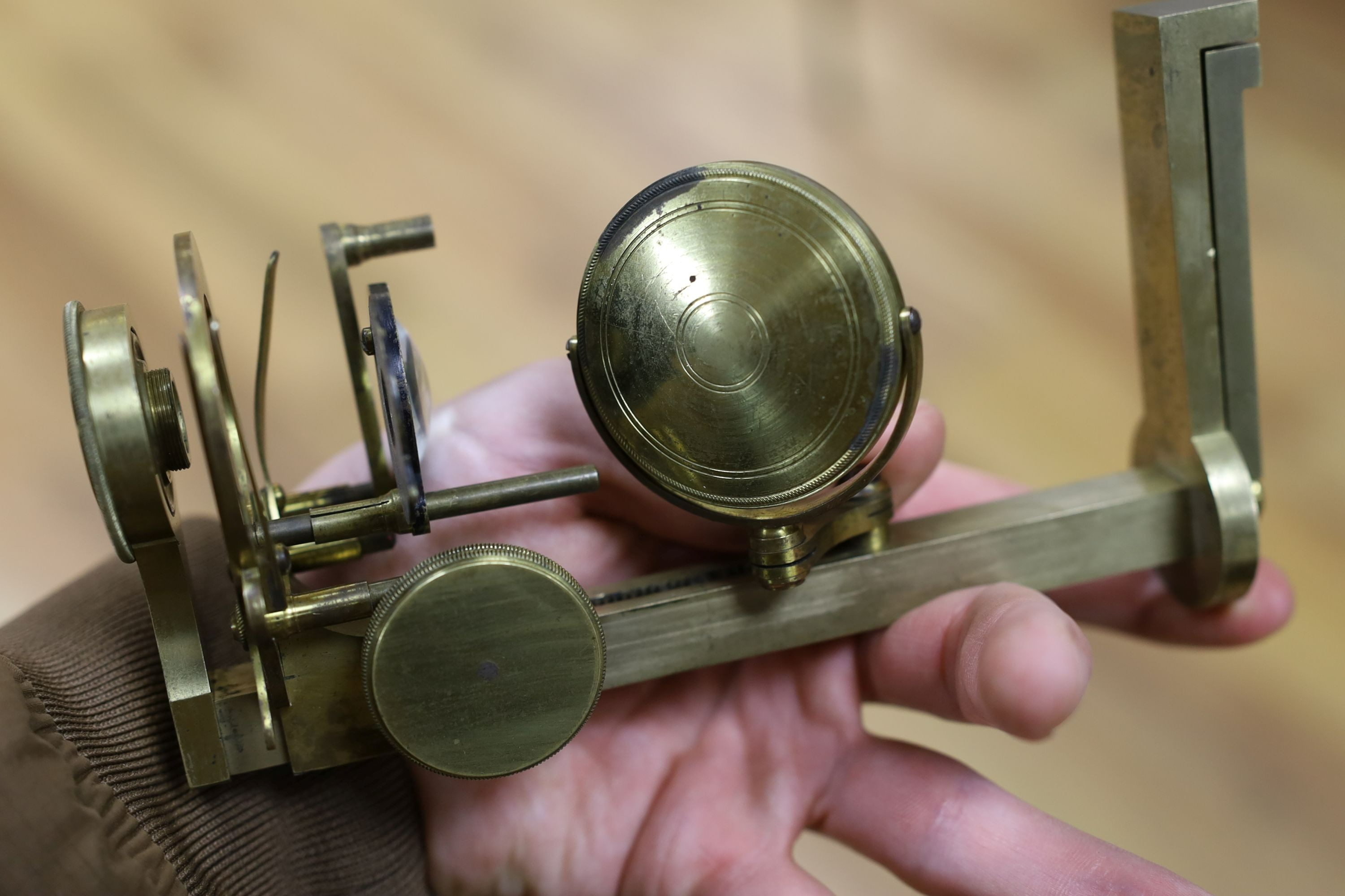 A mahogany cased microscope and a pair of Burdizzo tail dockers, 40cms long